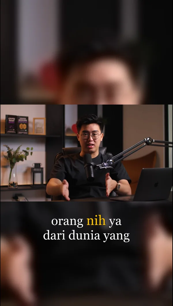 A podcast long video reframed to 9:16 with karaoke captions tracking the speaker